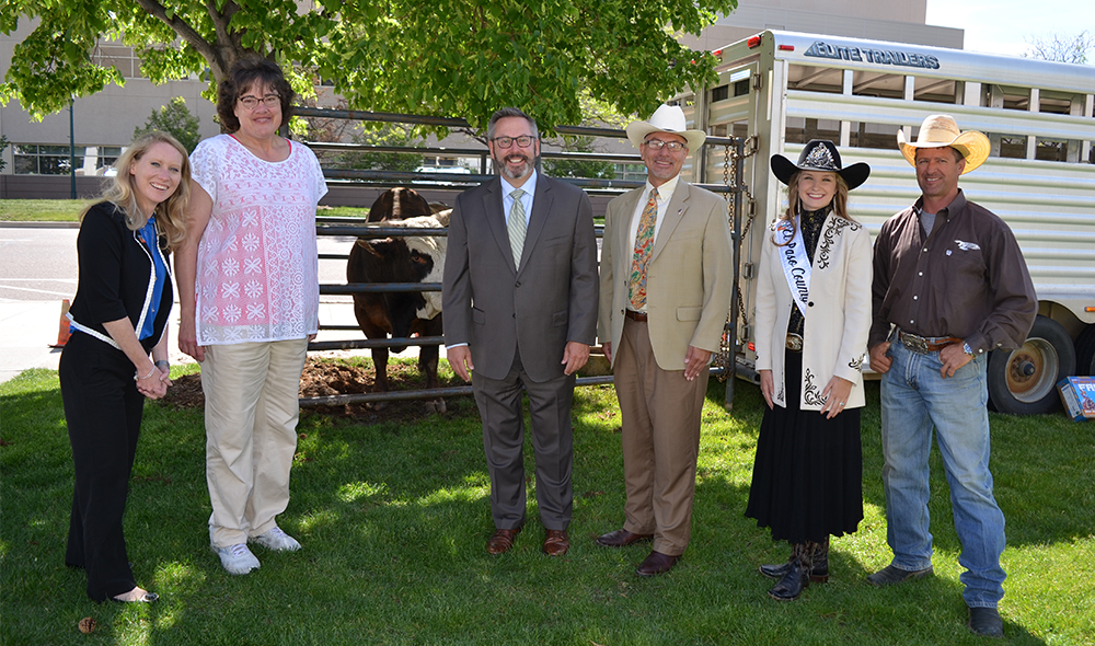 Commissioners with fair queen and bull owner Ty
